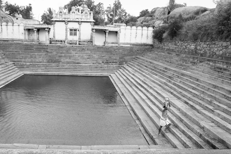 Traditional water supply science and technology of India - Tangi Kula – a sacred tank in Melkote town, Mandya district, Karnataka from where drinking water is being fetched by a priest